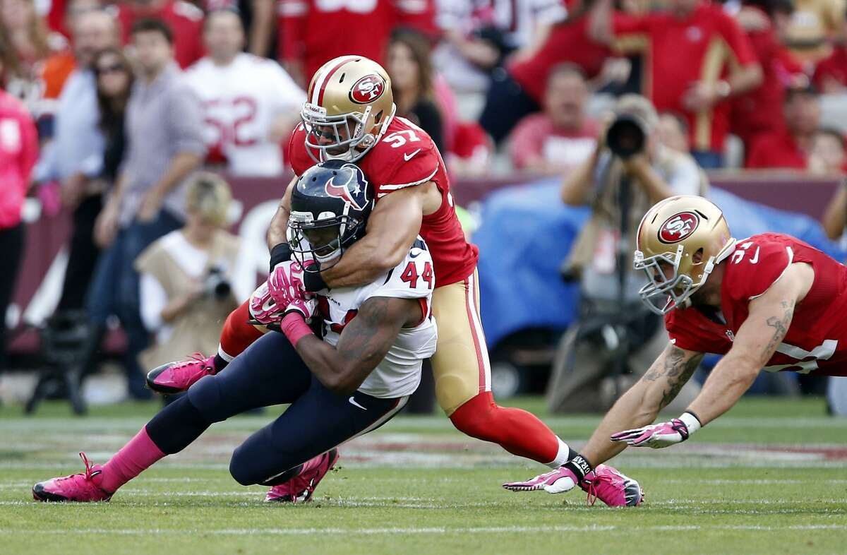 Houston Texans running back Ben Tate (44) is tackled by San Francisco 49ers linebacker Michael Wilhoite (57) as linebacker Dan Skuta moves in on the right, in the first half of an NFL football game in San Francisco, Sunday, Oct. 6, 2013. (AP Photo/Beck Diefenbach)