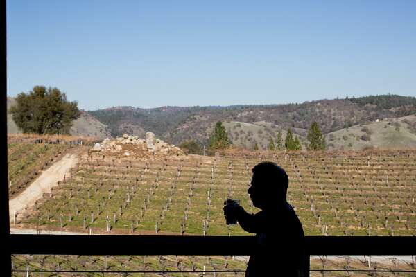 Volunteer Gary Ritz tastes beer on the deck overlooking Gold Hill Vineyard and Brewery which has seven different kinds of beer for guests to try in Placerville, Calif., Saturday, February 21, 2014.