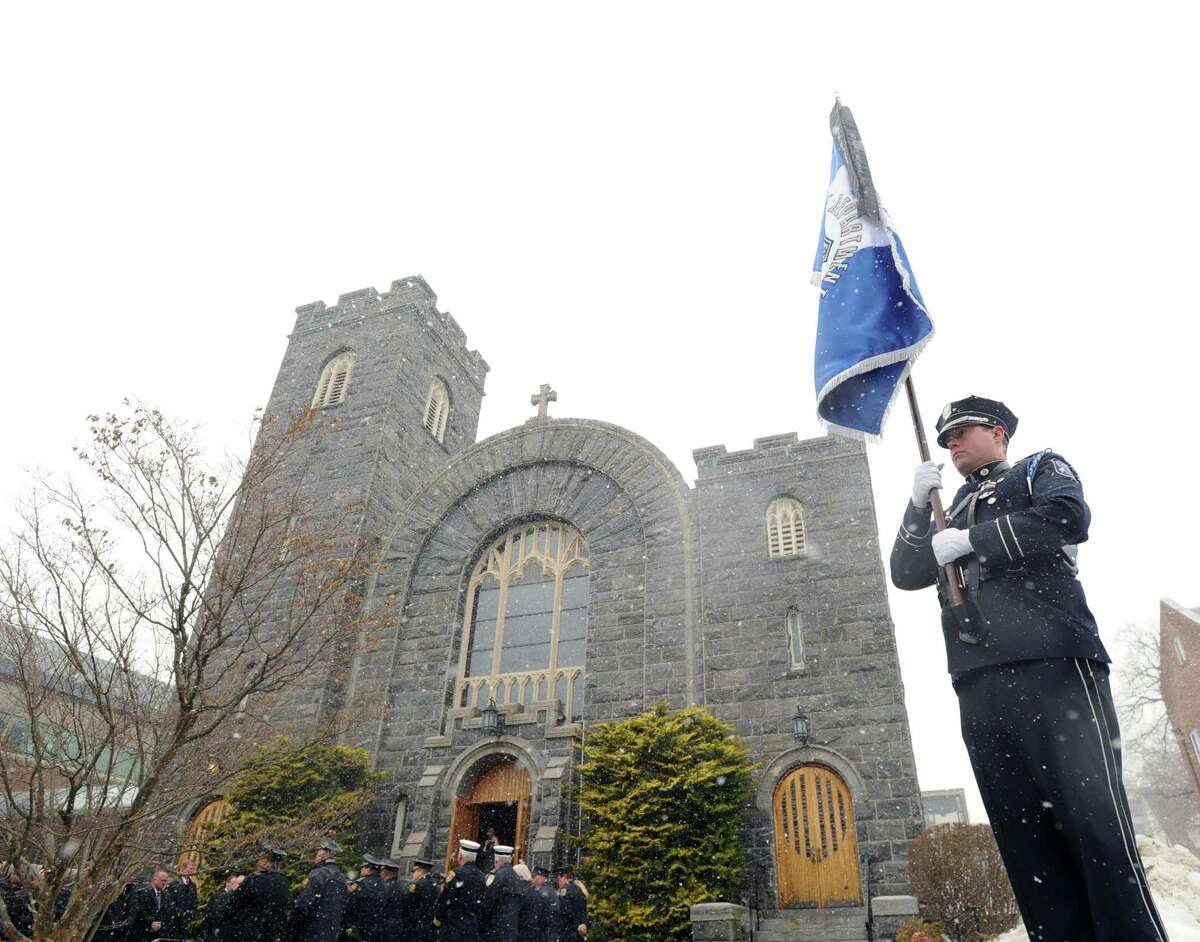 Funeral for Greenwich Police Sgt. Roger Petrone at St. Mary Church, Greenwich, Wednesday morning, Feb. 26, 2014. Petrone died Thursday at age 44 after a seven year battle with amyotrophic lateral sclerosis, also known as Lou Gehrig's disease.
