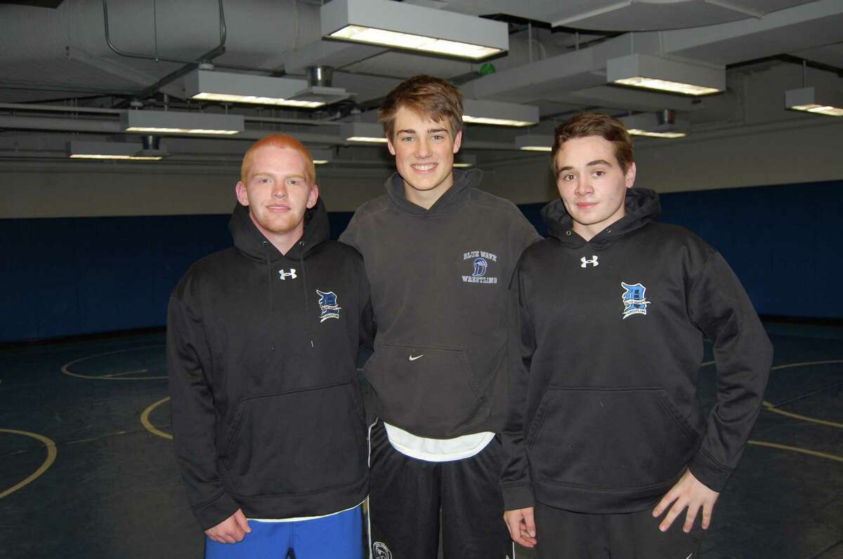 From left, Darien senior wrestling captains David Ziga, Colton Appleby and Tyler Hill. By Dave Crandall