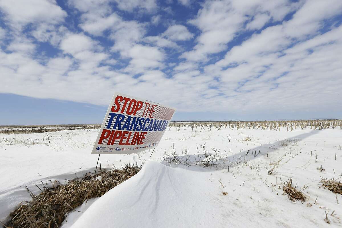 FILE - In this March 11, 2013 photo, a sign reading "Stop the Transcanada Pipeline" stands in a field near Bradshaw, Neb., along the Keystone XL pipeline route through the state. A Nebraska district court struck down a law that allowed the Keystone XL oil pipeline to proceed through the state, Wednesday, Feb. 19, 2014. The law could have been used to force landowners to allow the pipeline on their property. (AP Photo/Nati Harnik, File)