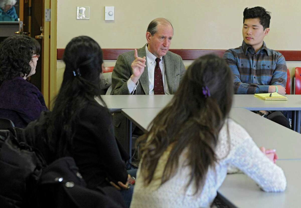 Alfred Sommer, a renowned public health expert, center, speaks with health students at Union College on Wednesday, Feb. 26, 2014, in Schenectady, N.Y. Sommer will be speaking at the school tomorrow. (Lori Van Buren / Times Union)
