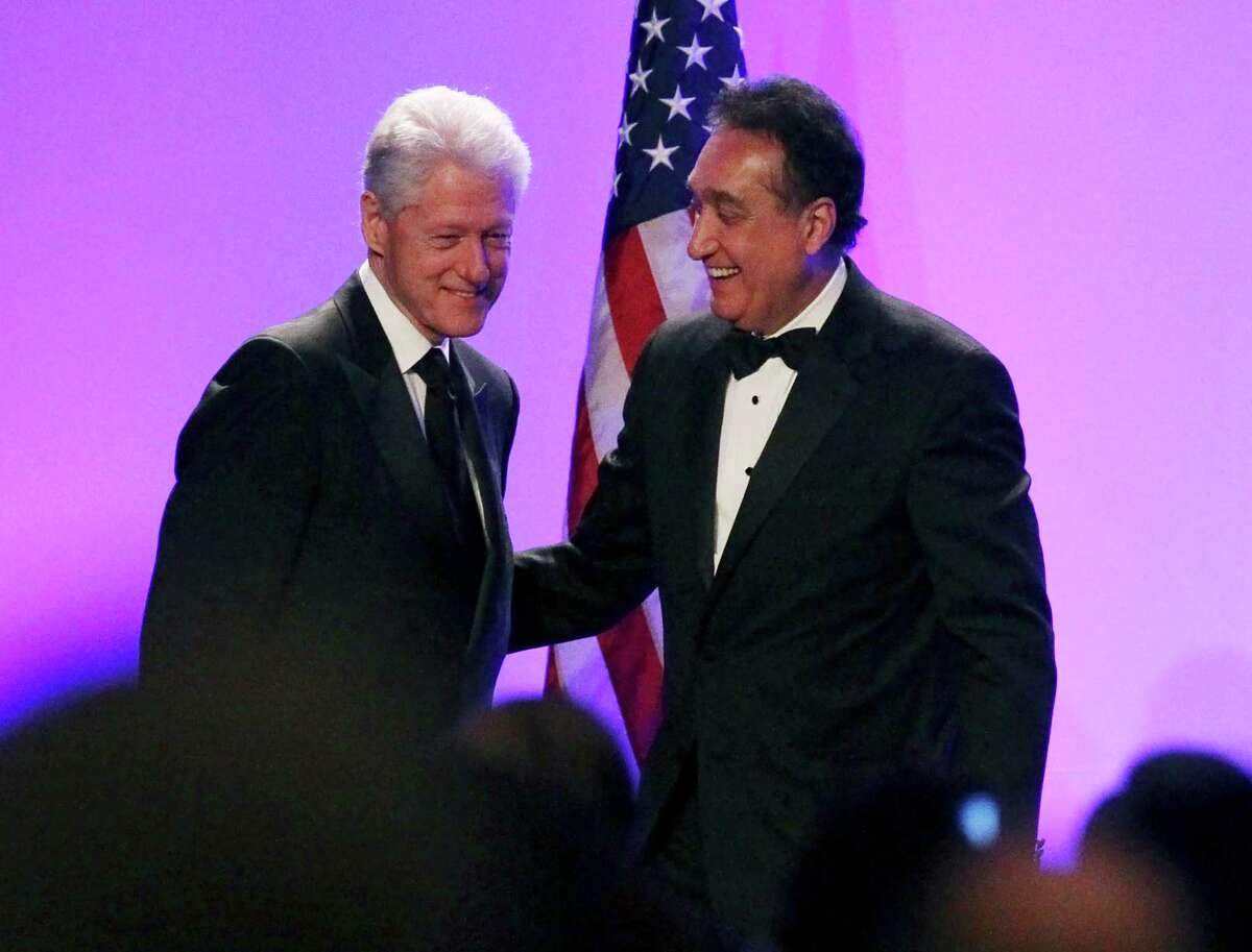 Former President Bill Clinton helped honor former Secretary of Housing appointee and friend Henry Cisneros (right).