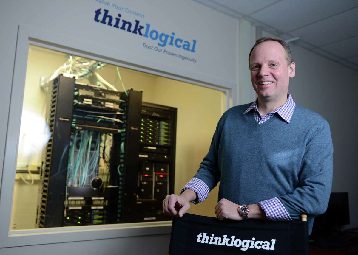 Thinklogical President and CEO Joe Pajer poses for a photo Wednesday, Feb. 26, 2014, at the tech company's Milford headquarters.