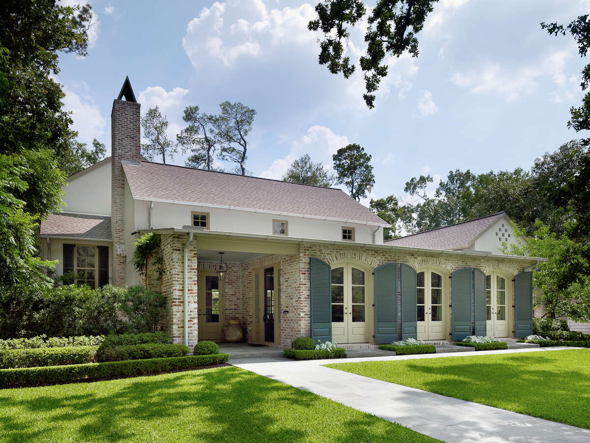 The inviting home design blends elements of Acadian, Spanish and plantation architecture.