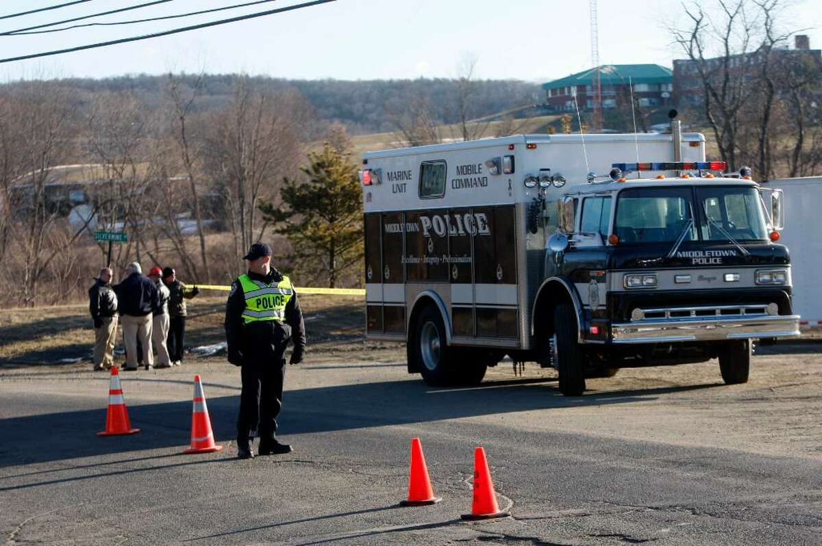 Police block the road Monday, Feb. 8, 2010 to the Kleen Energy Systems power plant damaged by Sunday's explosion that killed at least five workers and injured a dozen or more in Middletown, Conn. (AP Photo/Seth Wenig)
