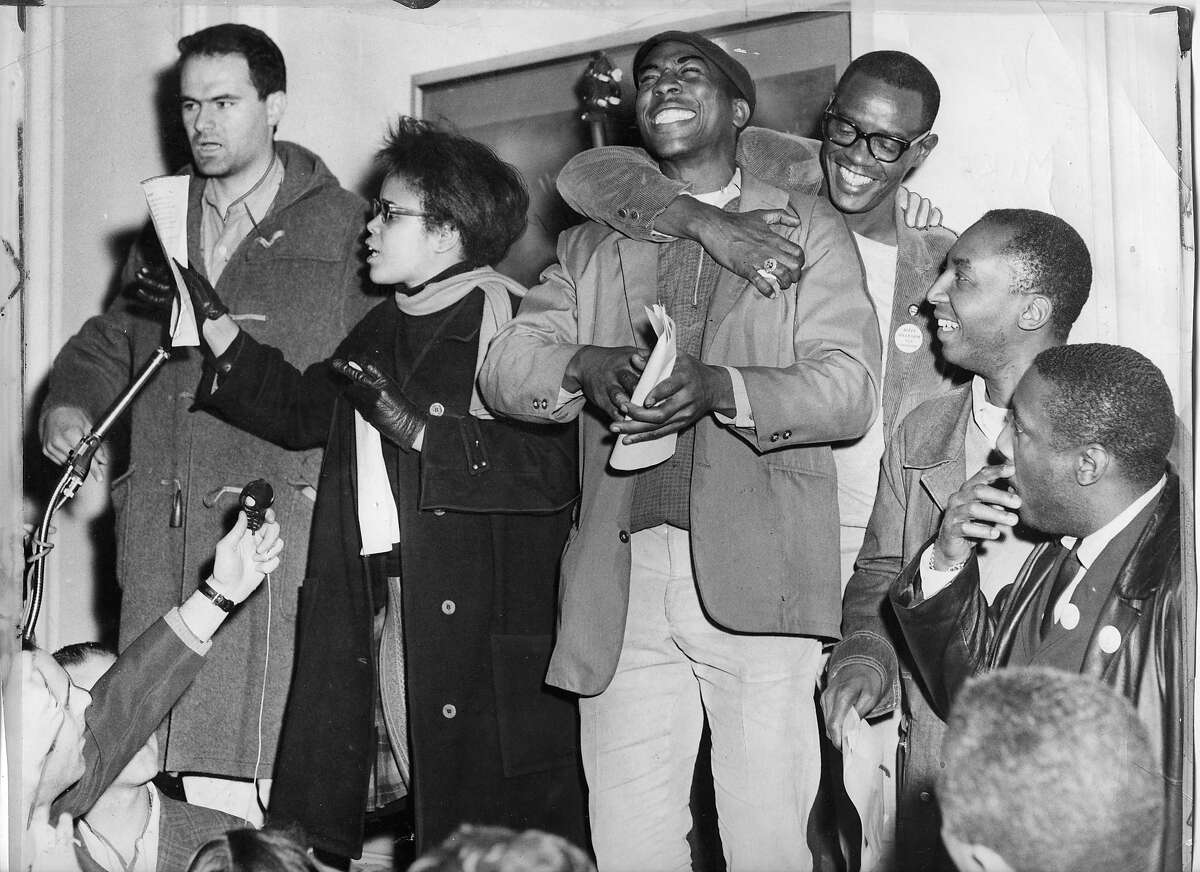 Protest leaders make an announcement (l-r) Mike Myerson, Tracy Sims, Roy Ballard, Dick Gregory. The Sheraton Palace hotel sit in and protest claimed discriminatory hiring practices. Photo ran Sunday March 8, 1964, Page A1