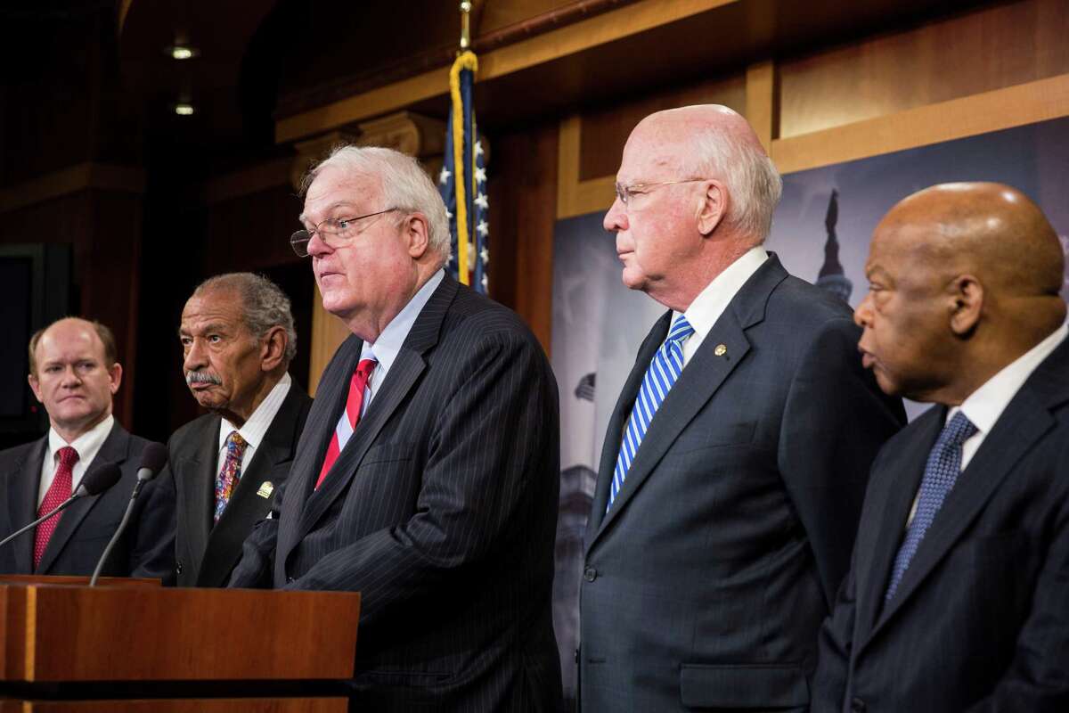 WASHINGTON, DC - JANUARY 16: (L ro R) U.S. Sen. Chris Coons (D-DE), Rep. John Conyers, Rep. Jim Sensenbrenner (R-WI), Sen. Patrick Leahy (D-VT), and Rep. John Lewis (D-GA), hold a news conference on Capitol Hill, January 16, 2014 in Washington, DC. The group of lawmakers announced that they are introducing legislation, the Voting Rights Amendment Act of 2014, that would restore keys parts of the 1965 Voting Rights Act. (Photo by Drew Angerer/Getty Images)