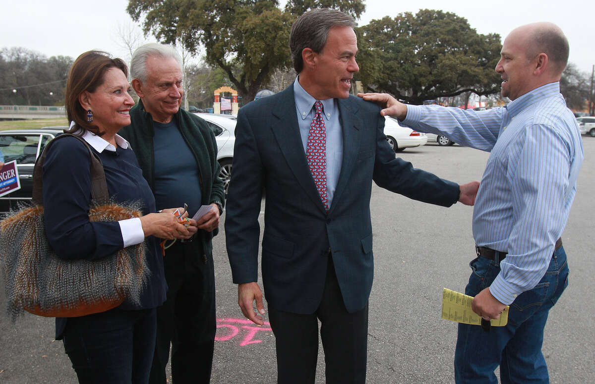 Joe Straus (center), speaker of the Texas House, talks with Jorge Canseco (right) at Lions Field Park on the last day of early voting for Tuesday's primary. Standing on the left are Jan and Bob Marbut.