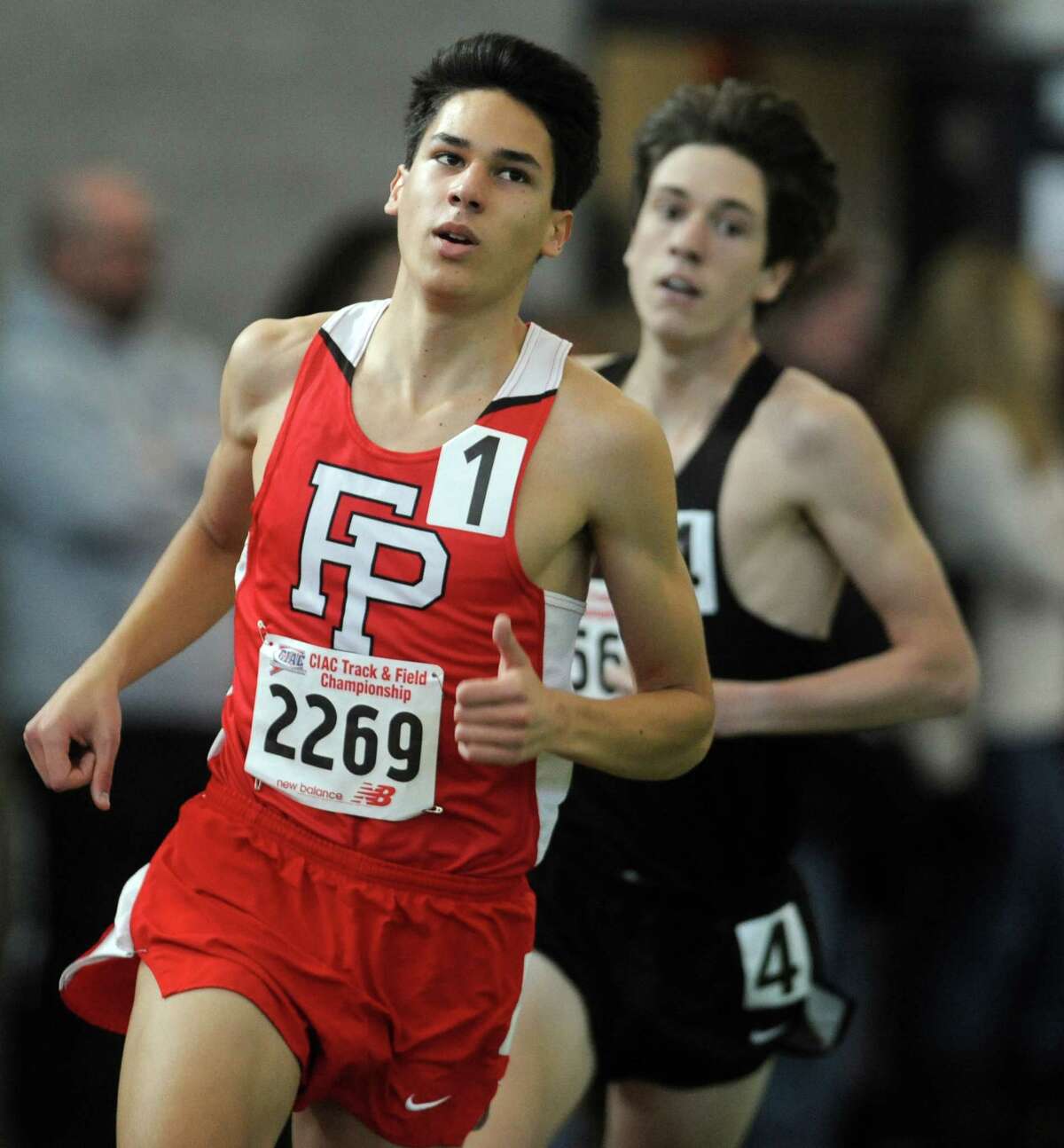 Fairfield Prep's Christian Alvarado competes in the 1600 meter race Saturday, Feb. 8, 2014, during the CIAC Class LL Boys and Girls track championships at the Floyd Little Athletic Center in New Haven, Conn.