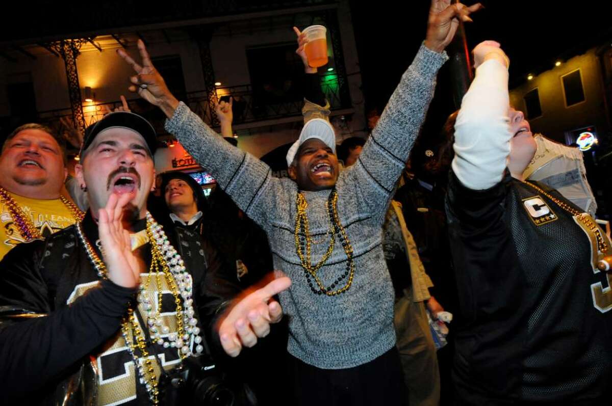 NEW ORLEANS - FEBRUARY 07: Fans celebrate the New Orleans Saints win against the Indianapolis Colts during Super Bowl XLIV on Bourbon Street in the French Quarter on February 7, 2010 in New Orleans, Louisiana. The Saints defeated the Colts, 31-17. (Photo by Cheryl Gerber/Getty Images)
