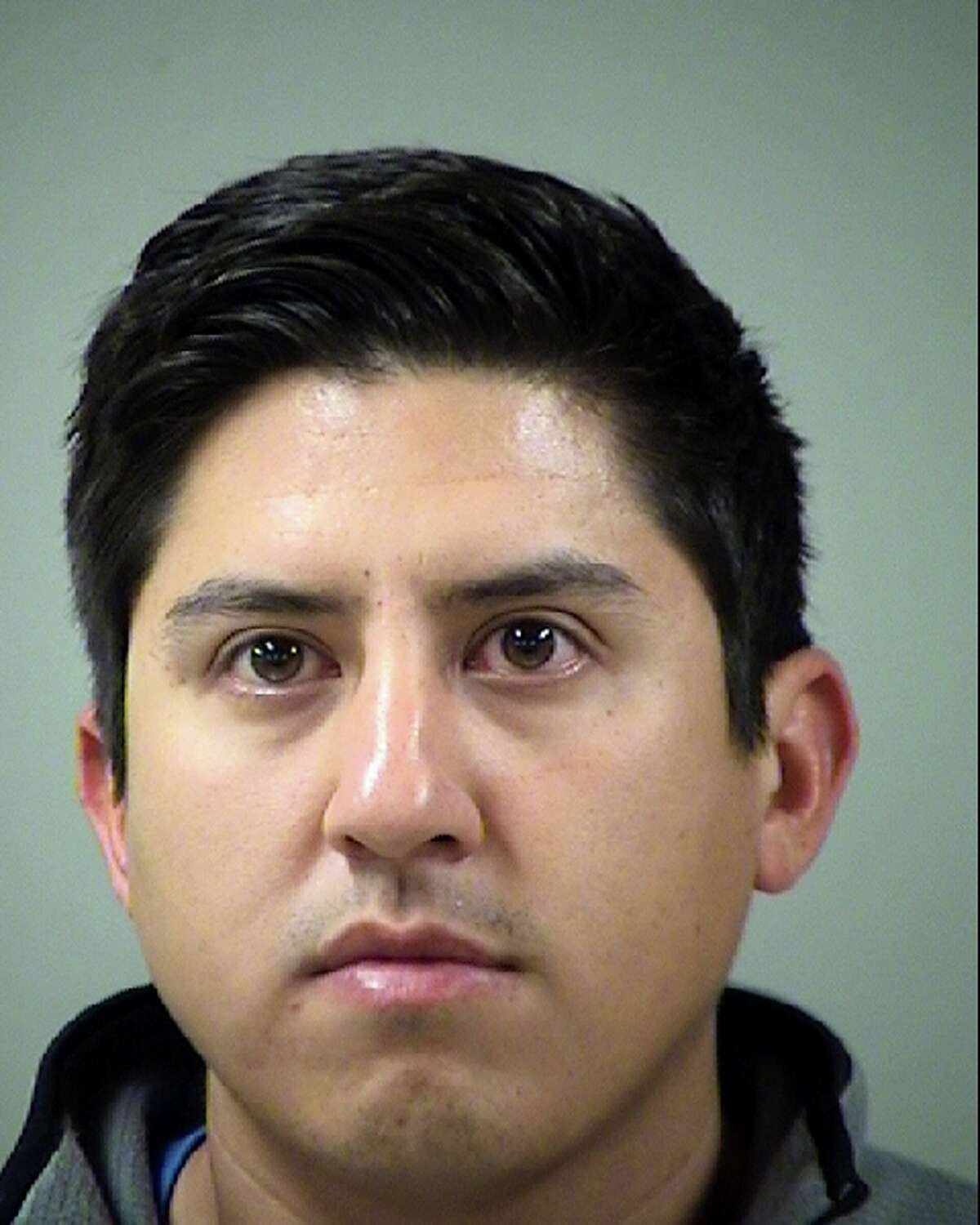 Lauro "Larry" Eduard Ruiz, seen in an undated booking mug provided Saturday March 1, 2014 by the Bexar County Sheriff Department, was arrested Friday Feb. 28, 2014 by Castle Hills Police Department officers and charged with Improper Photography. Ruiz is accused of taking so-called "up-skirt" pictures of female students at Antonian High School, where he used to teach and coach before being fired this week.