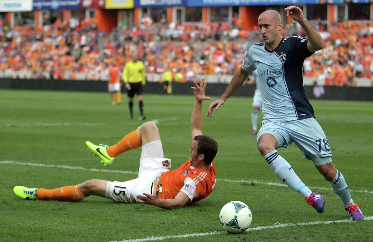Dynamo forward Cam Weaver is left in the wake of Sporting Kansas City defender Aurelien Collin during the second half of the MLS Eastern Conference final. Collin enjoys an unsavory reputation in MLS.