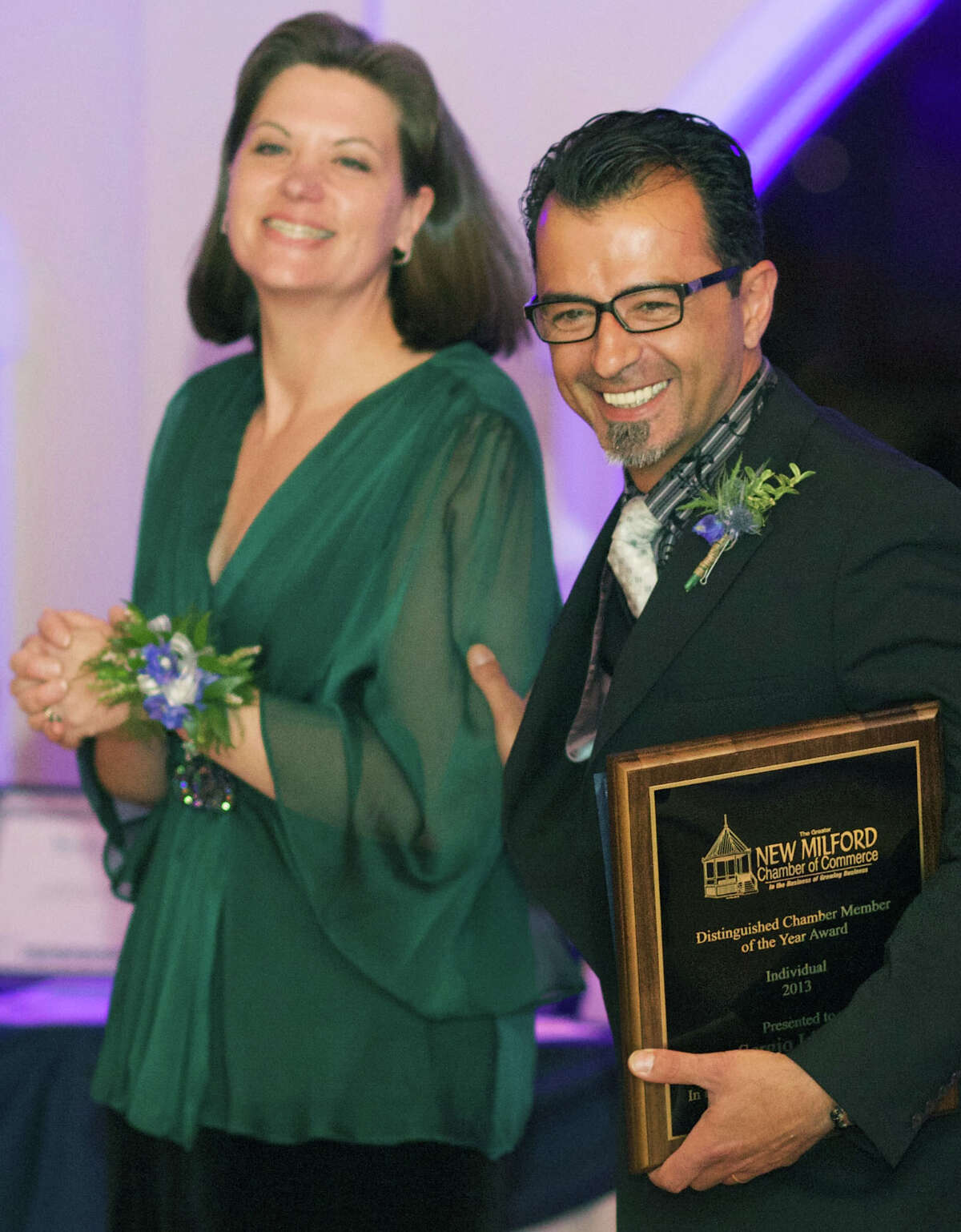 Sergio Liguori shares his moment in the spotlight with Greater New Milford Chamber of Commerce Executive Director Denise Del Mastro as he receives the organization's