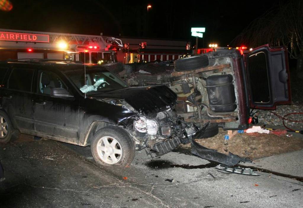 Man injured when car runs stop sign, flips Jeep