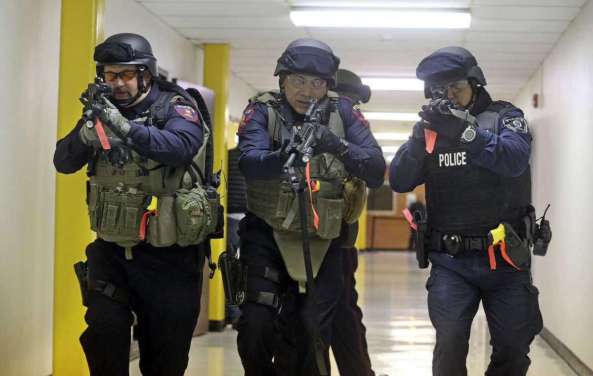 Team members prepare to check out a classroom as the Judson ISD Emergency Response team practices with a drill at the Judson Education Community Center on Feb. 6.