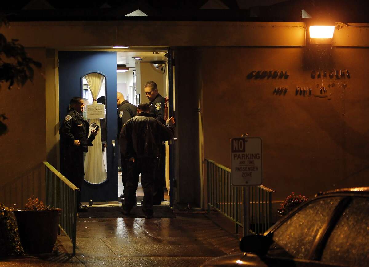San Francisco Police officers stand guard in front of the Central Gardens Skilled Nursing Facility on Monday, March 3, 2014, in San Francisco, Calif., after two bodies were discovered following a welfare check. Police stated shortly after discovering the bodies that it appeared to be a murder-suicide.