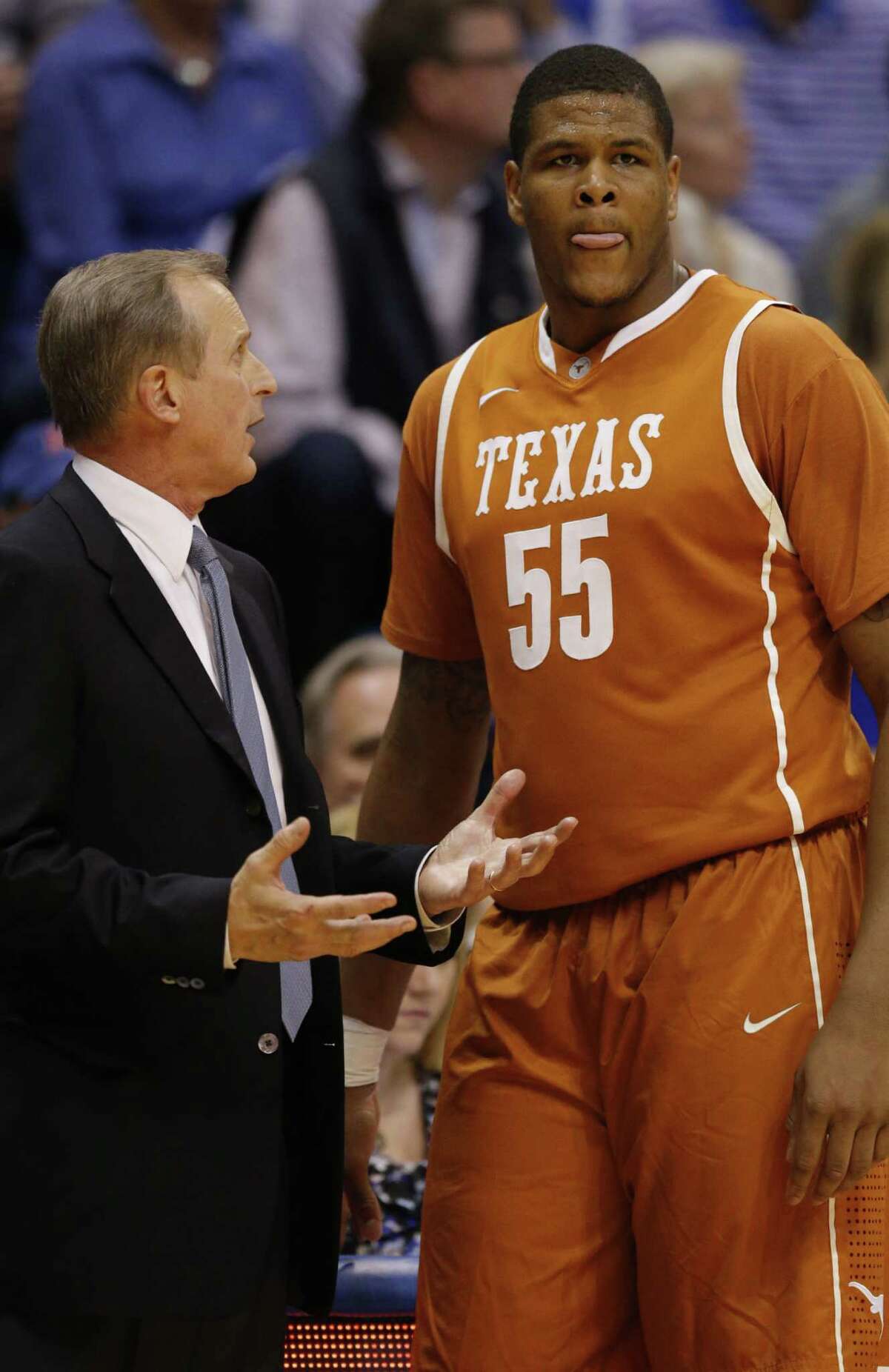 Texas head coach Rick Barnes and center Cameron Ridley (55) during the second half of an NCAA college basketball game against Kansas in Lawrence, Kan., Saturday, Feb. 22, 2014. Kansas defeated Texas 85-54. (AP Photo/Orlin Wagner)