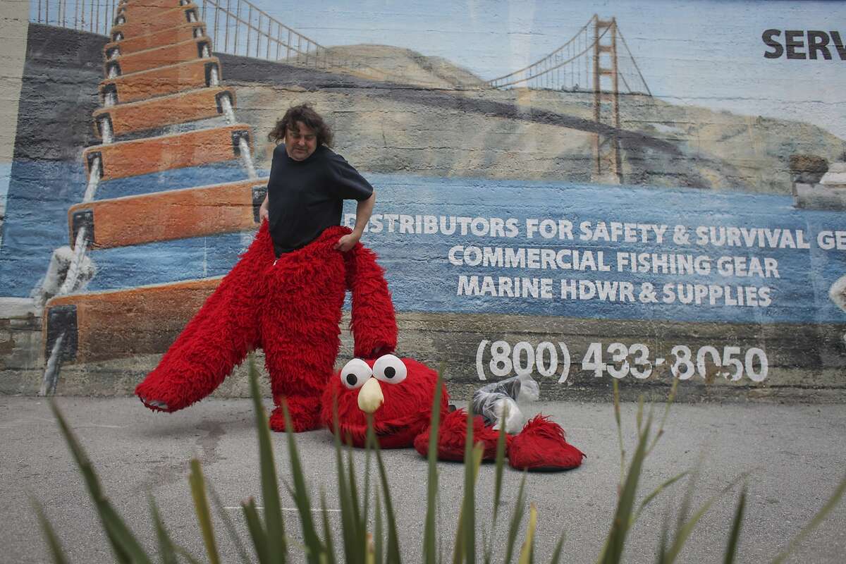 50-year-old Dan Sandler puts on his Elmo costume in Fisherman's Wharf on March 5th 2014. Sandlers has been known to go on various heated controversial rants while wearing the costume.