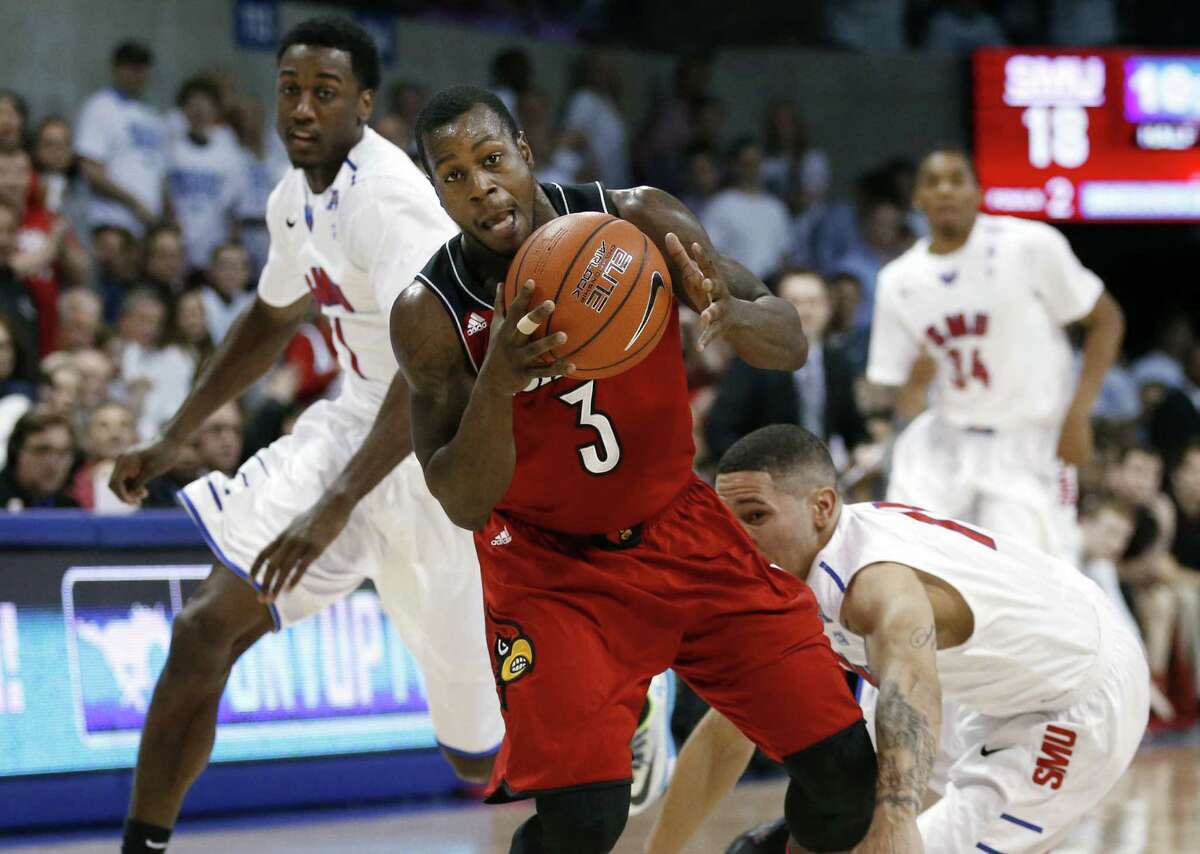 Chris Jones (center) and Louisville weathered a raucous sellout crowd to win 84-71 at SMU.
