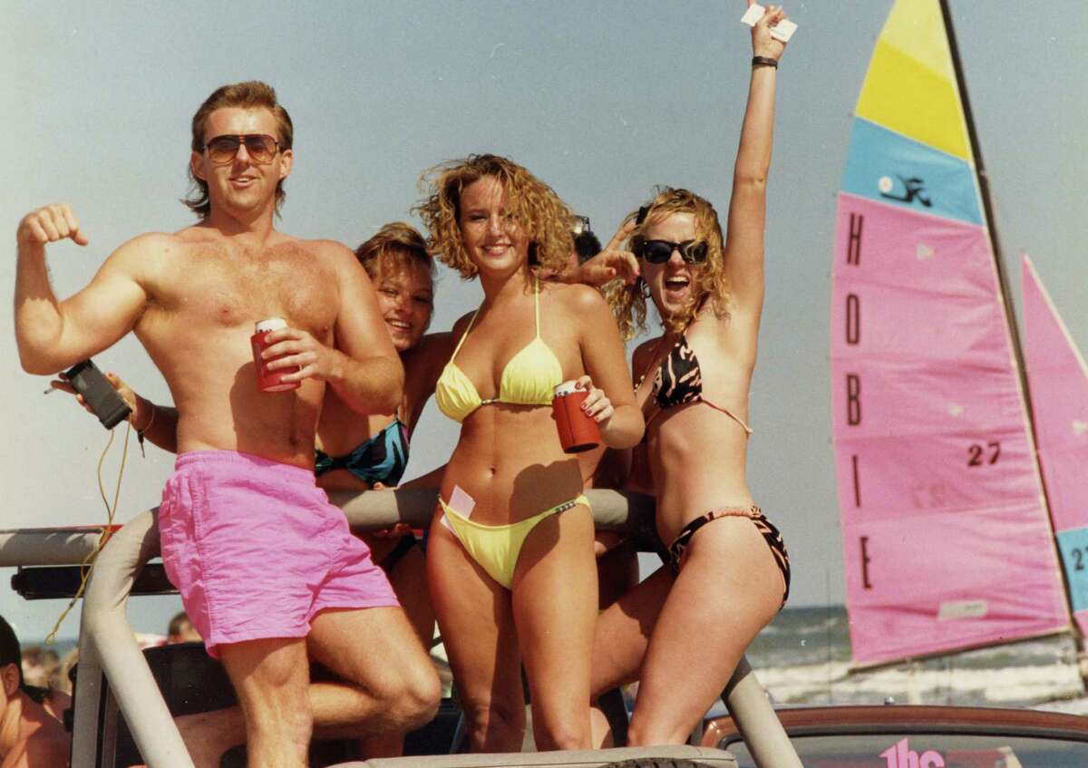 Unidentified revelers on Galveston s West Beach ride in the back of a pickup on a sunny, but brisk Sunday on the first weekend of Spring Break. March 10, 1991.