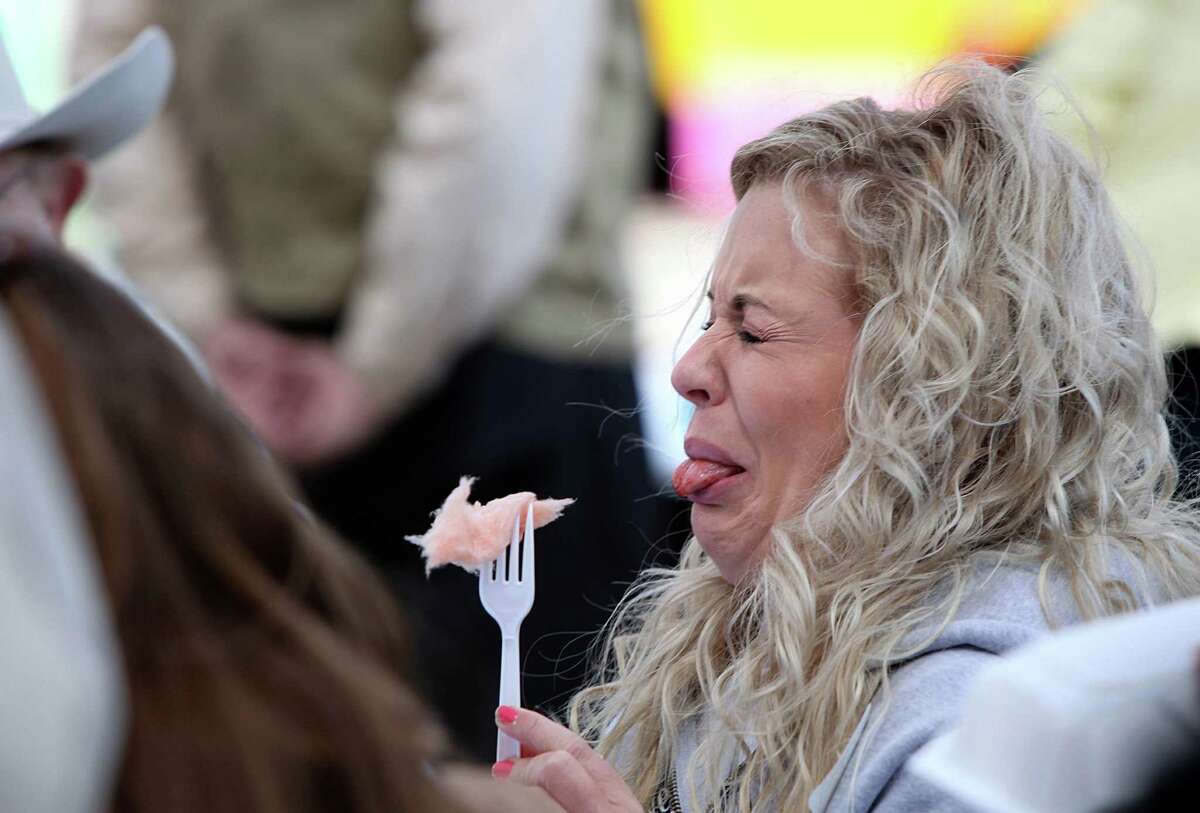 Maggie Flecknoe of KIAH-TV reacts to the bacon cotton candy while judging the Gold Buckle Foodie Awards.