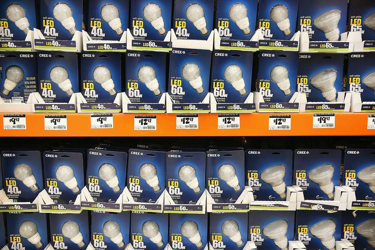 LED light bulbs are offered for sale at a Home Depot store on December 27, 2013 in Chicago, Illinois. On January 1, 2014 manufacturers will stop producing 40 and 60 watt incandescent light bulbs in the United States. The 75 and 100 watt bulbs were discontinued in 2013. These incandescent bulbs are being replaced by the more energy efficient compact florescent and LED light bulbs. (Photo by Scott Olson/Getty Images)
