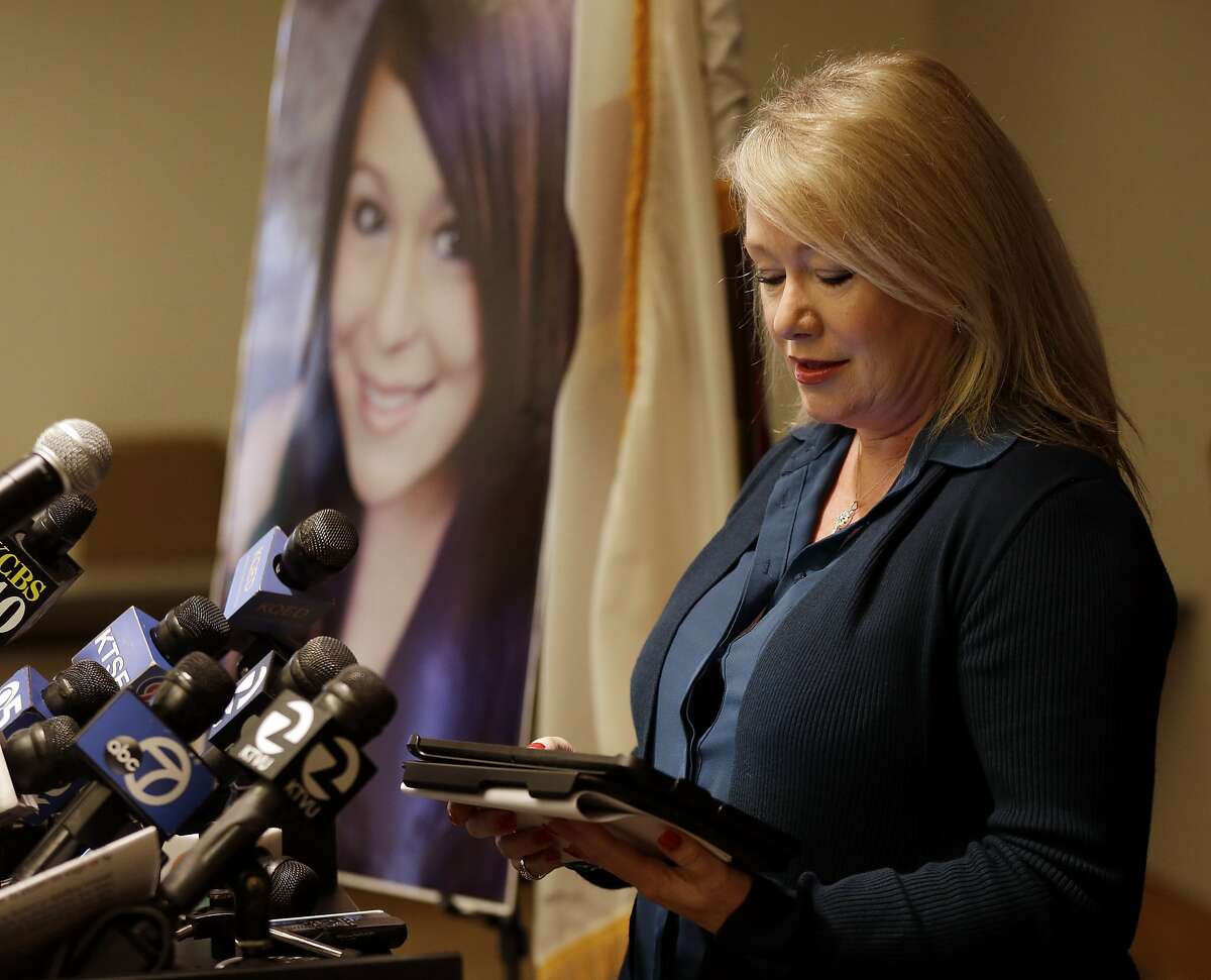 Sheila Pott, mother of Audrie Pott, reads a statement in support of Audrie's Law on Friday, March 7, 2014, in Saratoga, Calif. Audrie's Law is a legislative proposal aimed at deterring the bullying, cyberbullying, and sexual assault that played roles in the suicide of Audrie Pott, a 15-year-old Saratoga High School student. (AP Photo/Marcio Jose Sanchez)