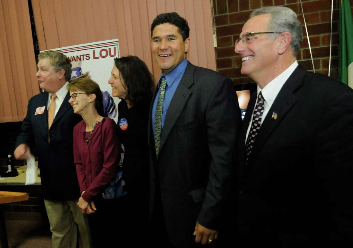 Troy victors, left to right, Rensselaer County Democrat Chairman Tom Wade, City Council president Lynn Kopka, City Council At Large candidates Nina Nichols , Rodney Wiltshire and Mayor Lou Rosamilla the Rensselaer Democrats election night party at Italian Community Center in Troy, NY Tuesday, Nov.8, 2011.( Michael P. Farrell/Times Union)