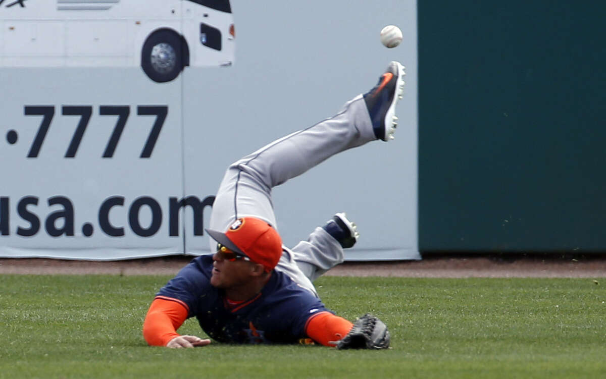 Astros right fielder George Springer can't catch Ian Desmond's hit during the Astros' 8-5 loss to the Nationals in Viera. Fla.