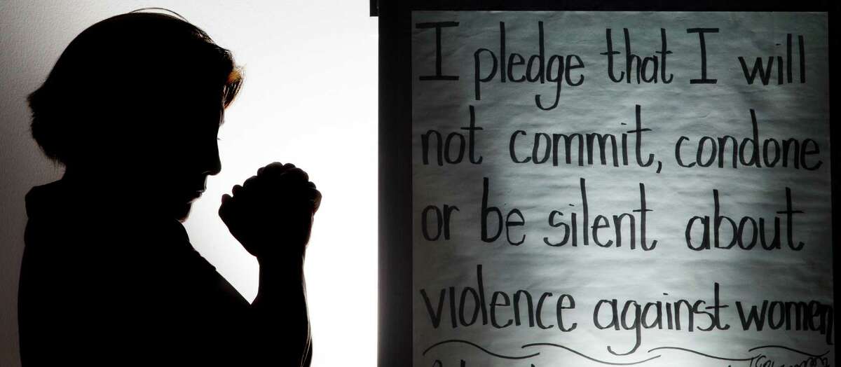 A domestic violence victim who wish not to be identify is silhouetted at The bridge over troubled waters' shelter on Monday, Jan. 27, 2014, in Pasadena. ( J. Patric Schneider / For the Chronicle )