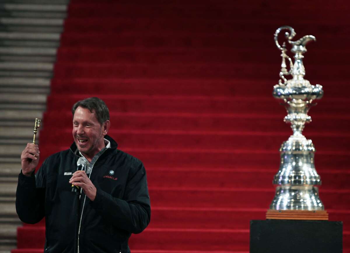 Larry Ellison owner of BMW Oracle Racing team holds up a key to the city presented to him by San Francisco Mayor Gavin Newsom during a ceremony at San Francisco City Hall on Saturday. Ellison and his team won the 33rd America's Cup in Spain earlier this month as representatives of The Golden Gate Yacht Club.