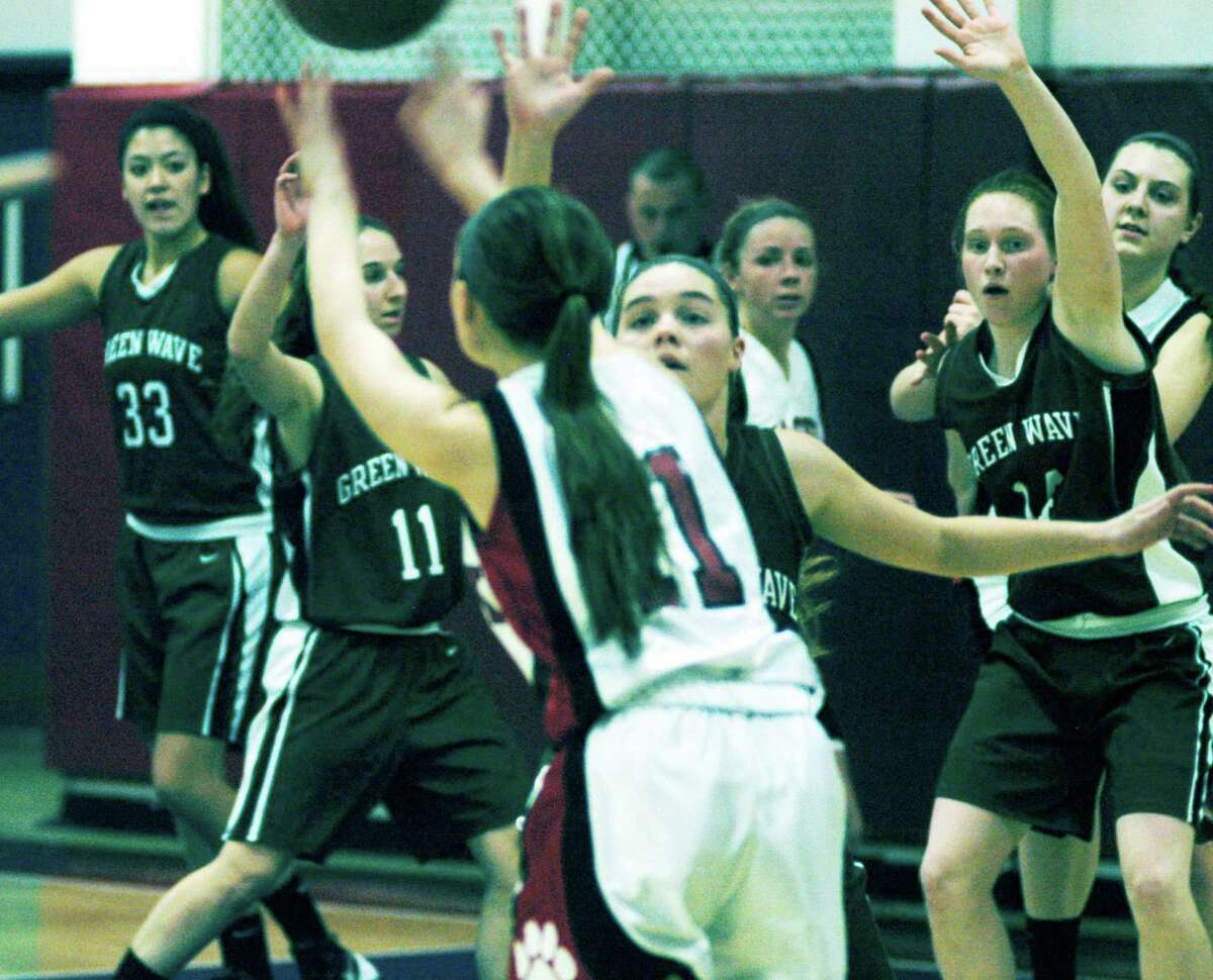 Standout defense played by the Green Wave proved the key during New Milford High School girls' basketball's 30-26 victory over Masuk in the South-West Conference playoff quarterfinals at Kolbe Cathedral High School in Bridgeport, Feb. 22, 204.