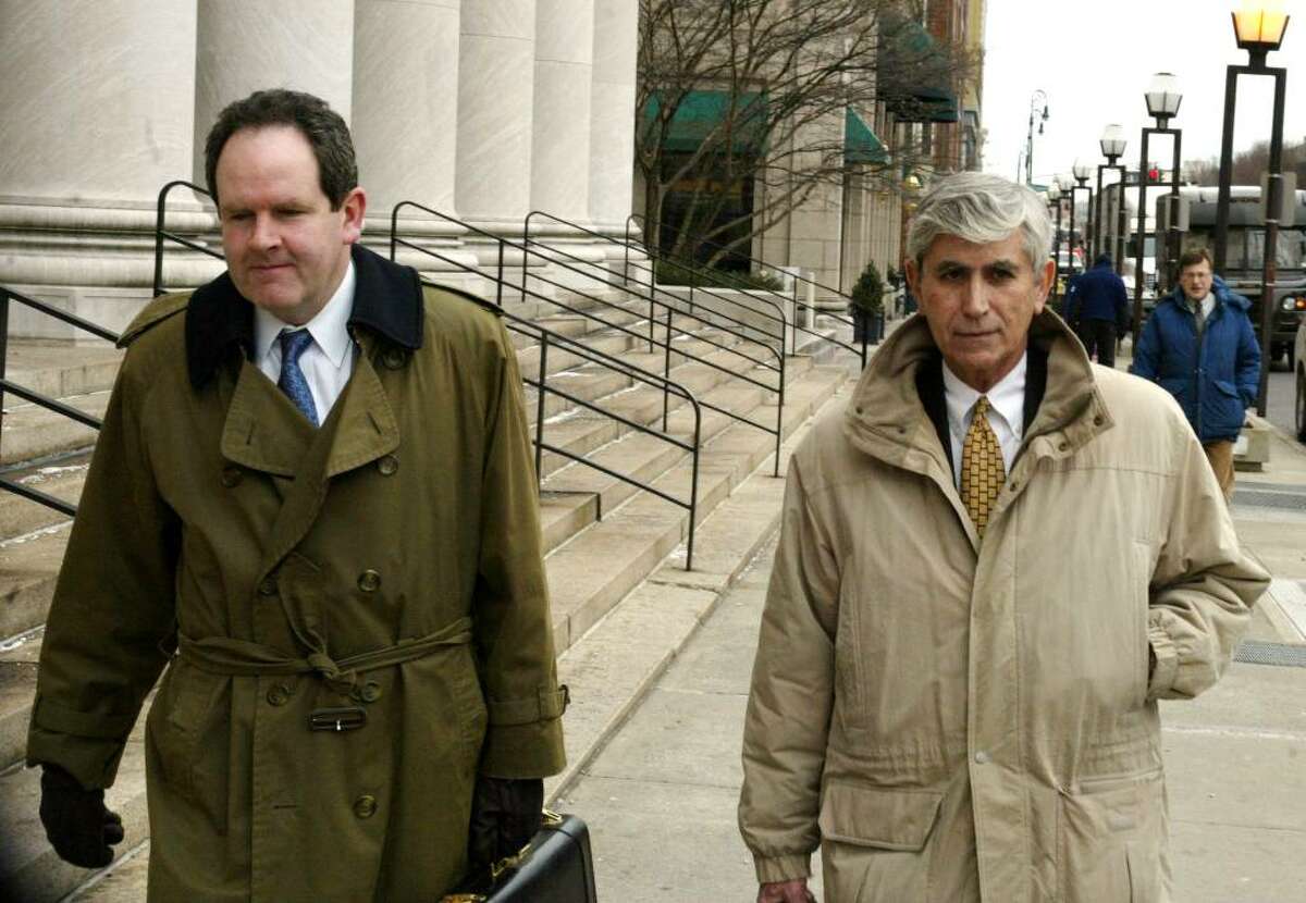 William Dow and David Grudberg, members of a New Haven law firm who are defending Perlitz, leave the New Haven Federal Courthouse on Feb. 2, 2010.