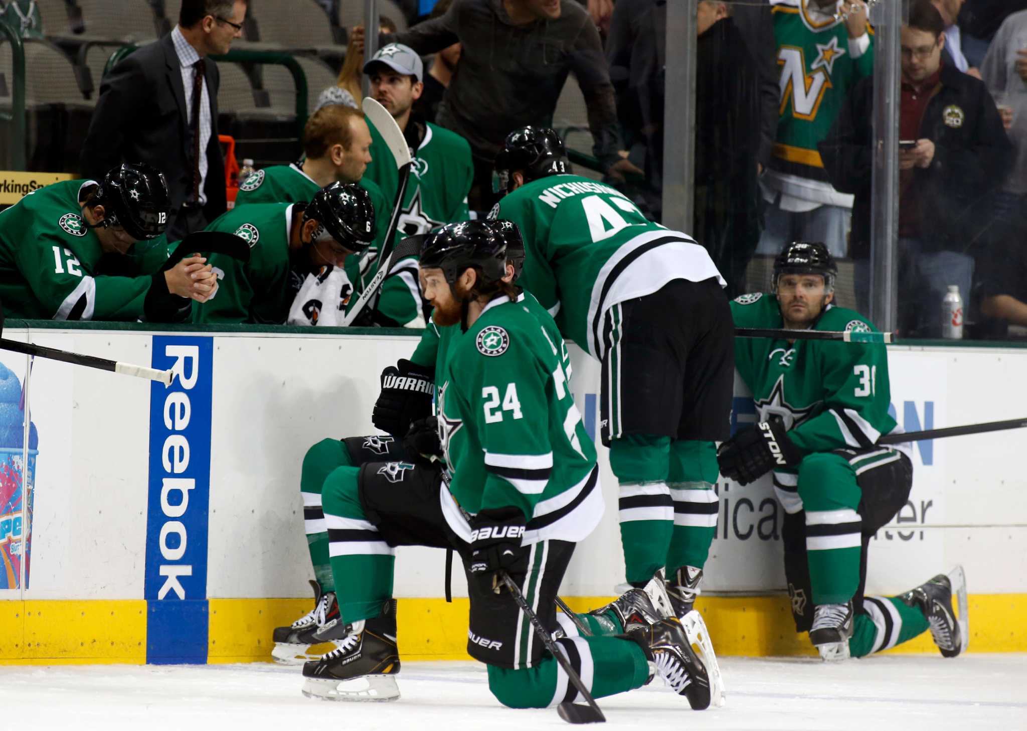 Dallas Stars player collapses on bench during game.