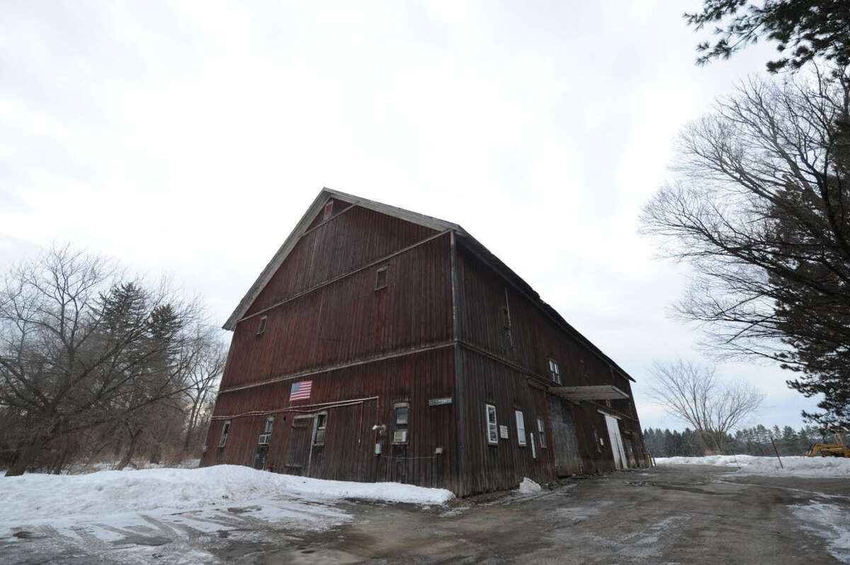 The Colonie Country Club has used the historic LeVie barn for storage, but current plans call for the building to be razed for the construction of a residential subdivision. (Photo by Michael P. Farrell/Times Union)