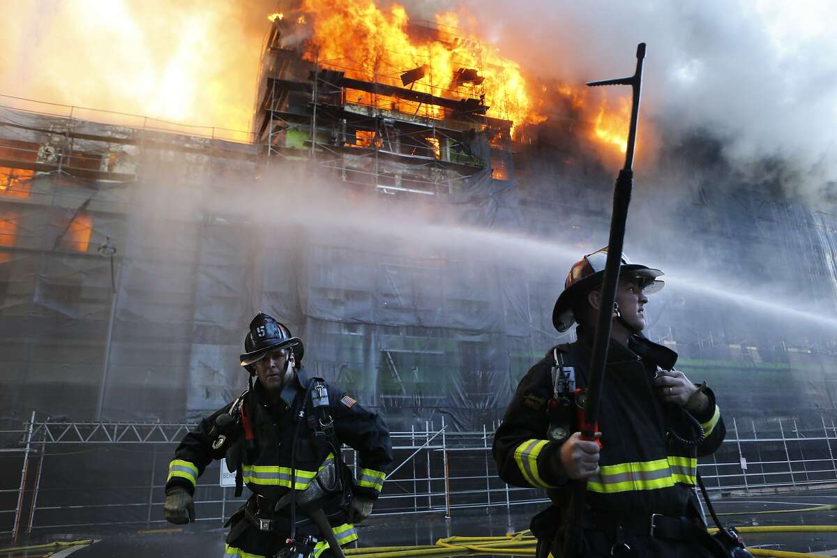 San Francisco firefighters battle a five alarm fire at a fire in the Mission Bay area of San Francisco, Calif. on Tuesday March 11, 2014.