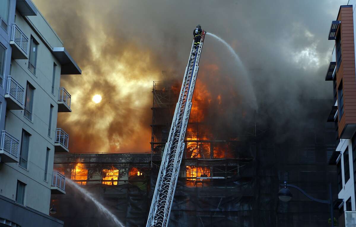 San Francisco firefighters battle a five alarm fire in the Mission Bay area of San Francisco, Calif. on Tuesday March 11, 2014.