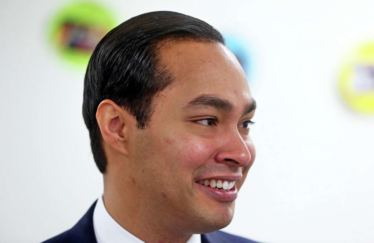 Mayor Julian Castro sports renewed dark hair as he helps to unveil the plans for additional educations centers during ceremonies at the Southside Pre-K4 SA center on February 19, 2014.