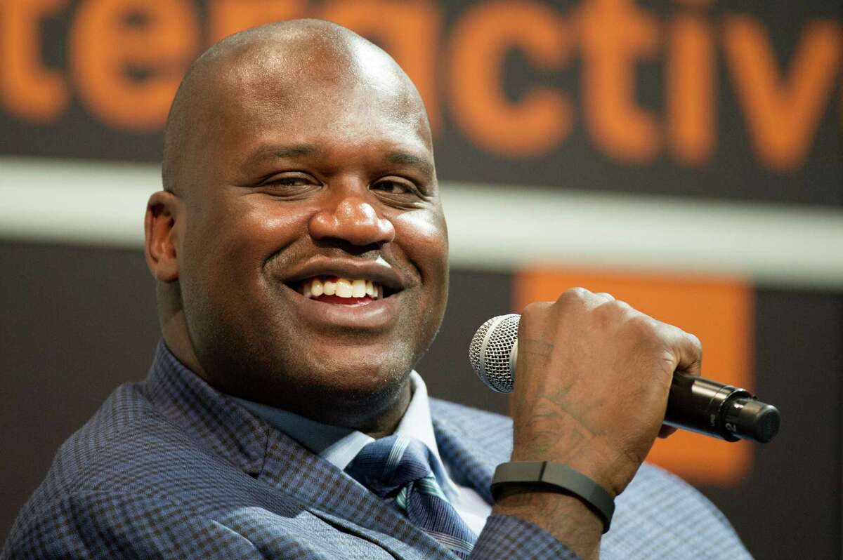 Shaquille "Shaq" O'Neal, former National Basketball Association (NBA) player, reacts during a featured session at the South By Southwest (SXSW) Interactive Festival in Austin, Texas, U.S., on Sunday, March 9, 2014. The SXSW conferences and festivals converge original music, independent films, and emerging technologies while fostering creative and professional growth. Photographer: David Paul Morris/Bloomberg *** Local Caption *** Shaquille O'Neal