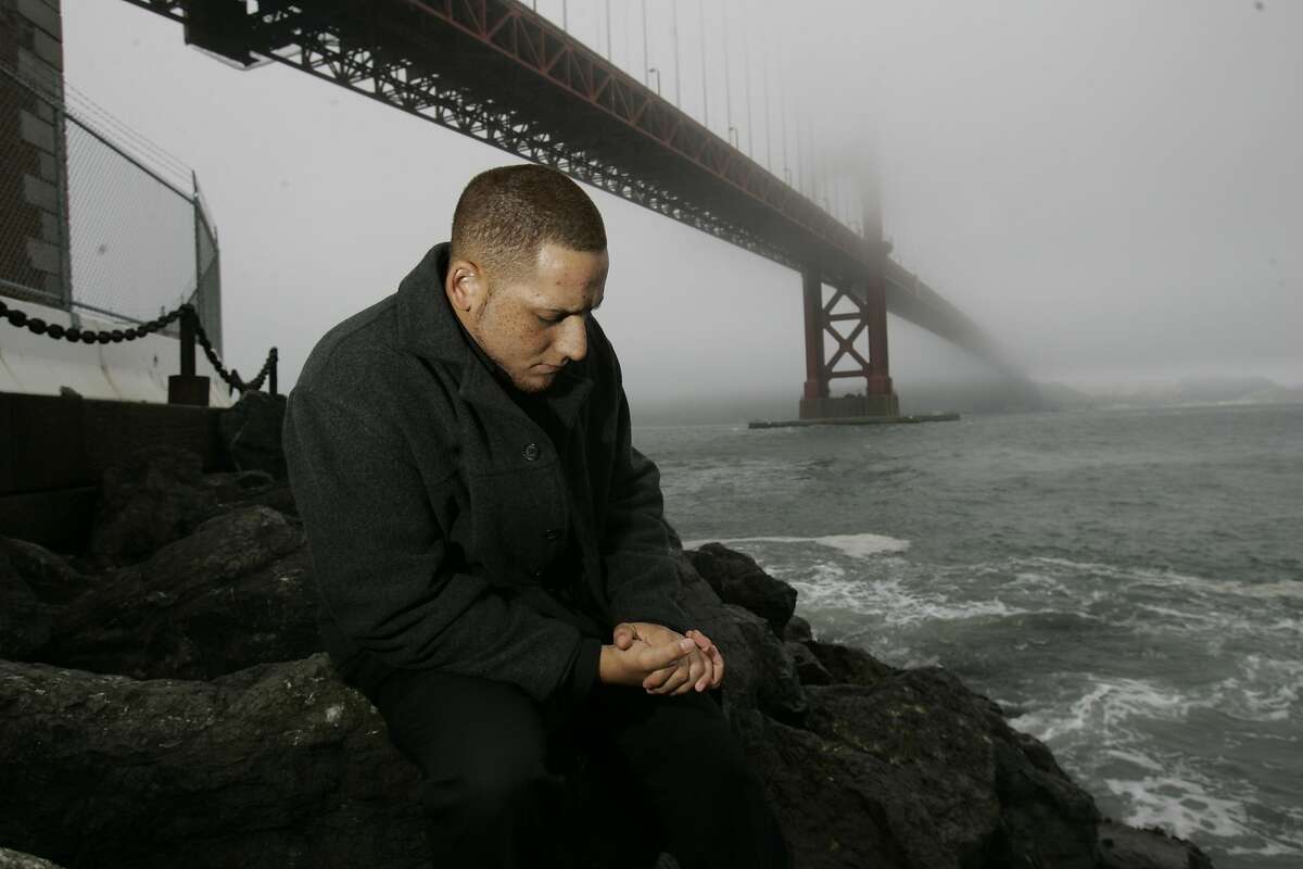 Kevin Hines, on the rocks next to Fort Point underneath the Golden Gate Bridge. He survived jumping off of the bridge in a suicide attempt. Kevin Hines was 19, with a history of depression, when he plunged over the bridge's guardrail, then decided he wanted to live. He became one of only 26 known survivors -- and found his mission. 