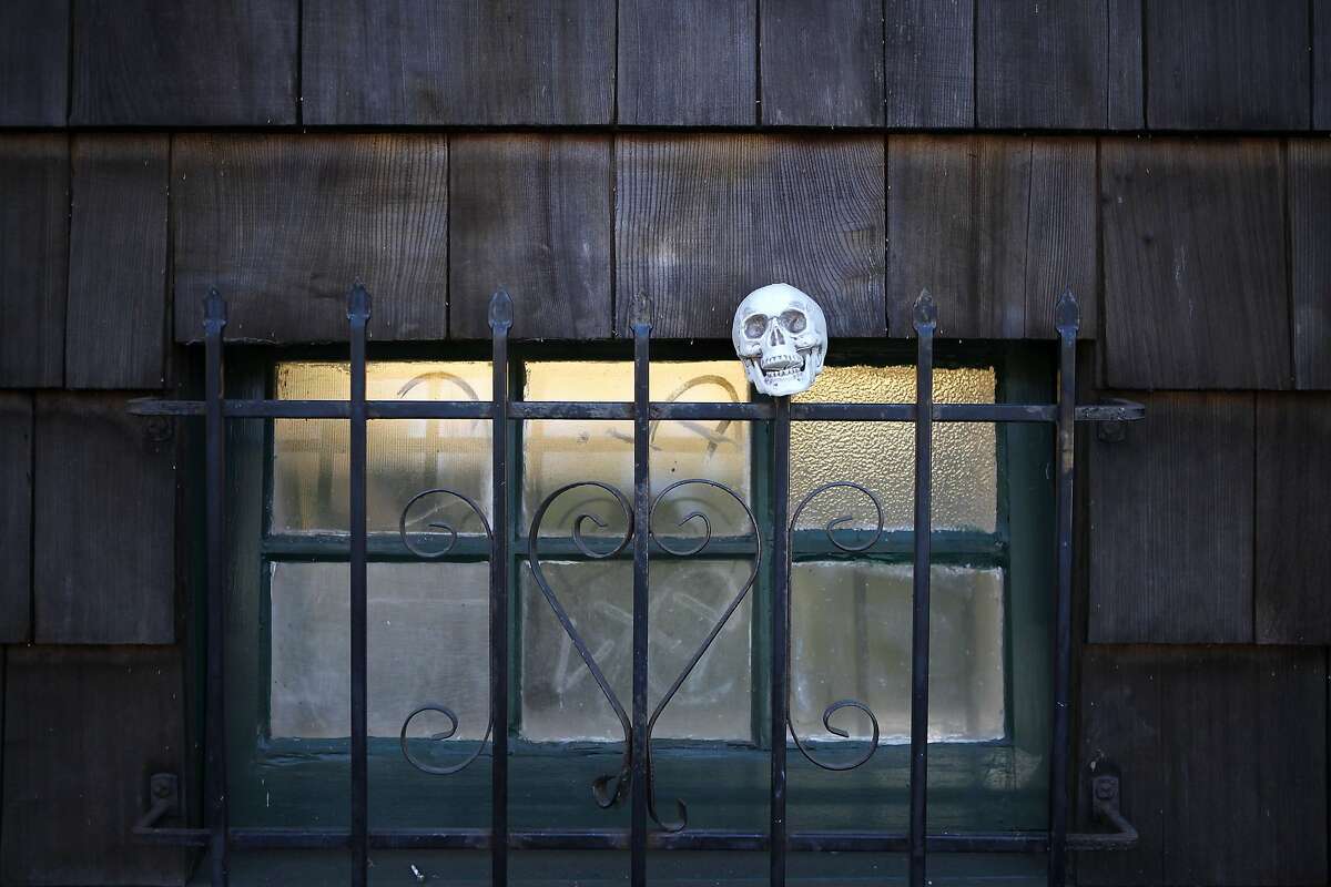 A plastic skull is stuck on the bars outside a window at the Cloyne Court co-op in Berkeley, CA, Tuesday, March 11, 2014. Cloyne Court student cooperative is a historic building on the Cal campus that is beloved by its 150 residents but recognized as a major insurance liability because of recent drug-related tragedies there. On Thursday, the co-op board will vote on whether to kick everyone out and transform it into a substance free residence.