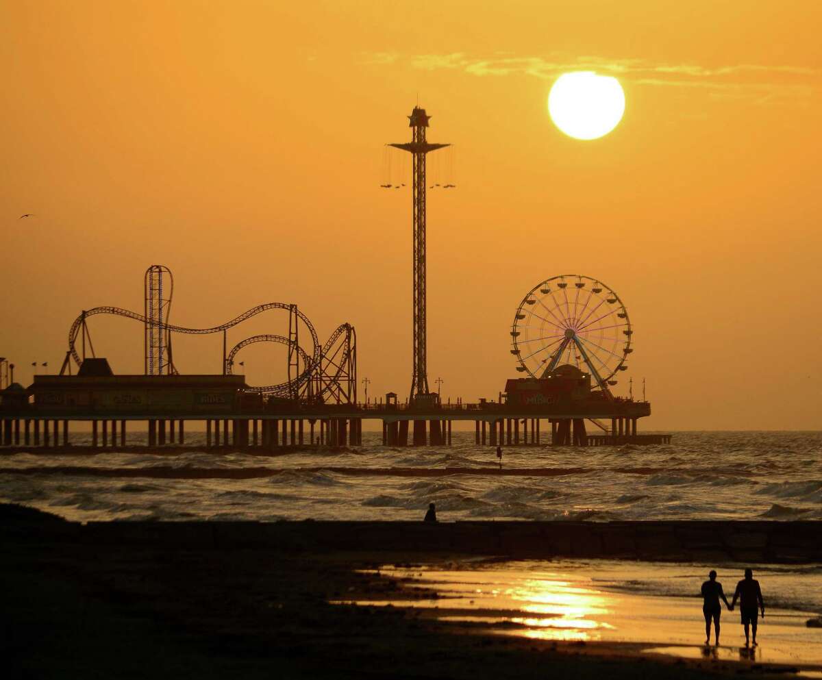 A golden-dawn walk along the beach in Galveston may bring a sunrise view of the Pleasure Pier in its dormancy, before the advancing day turns its family-friendly rides, midway games, restaurants and retail shops into a bustling hive of activity.