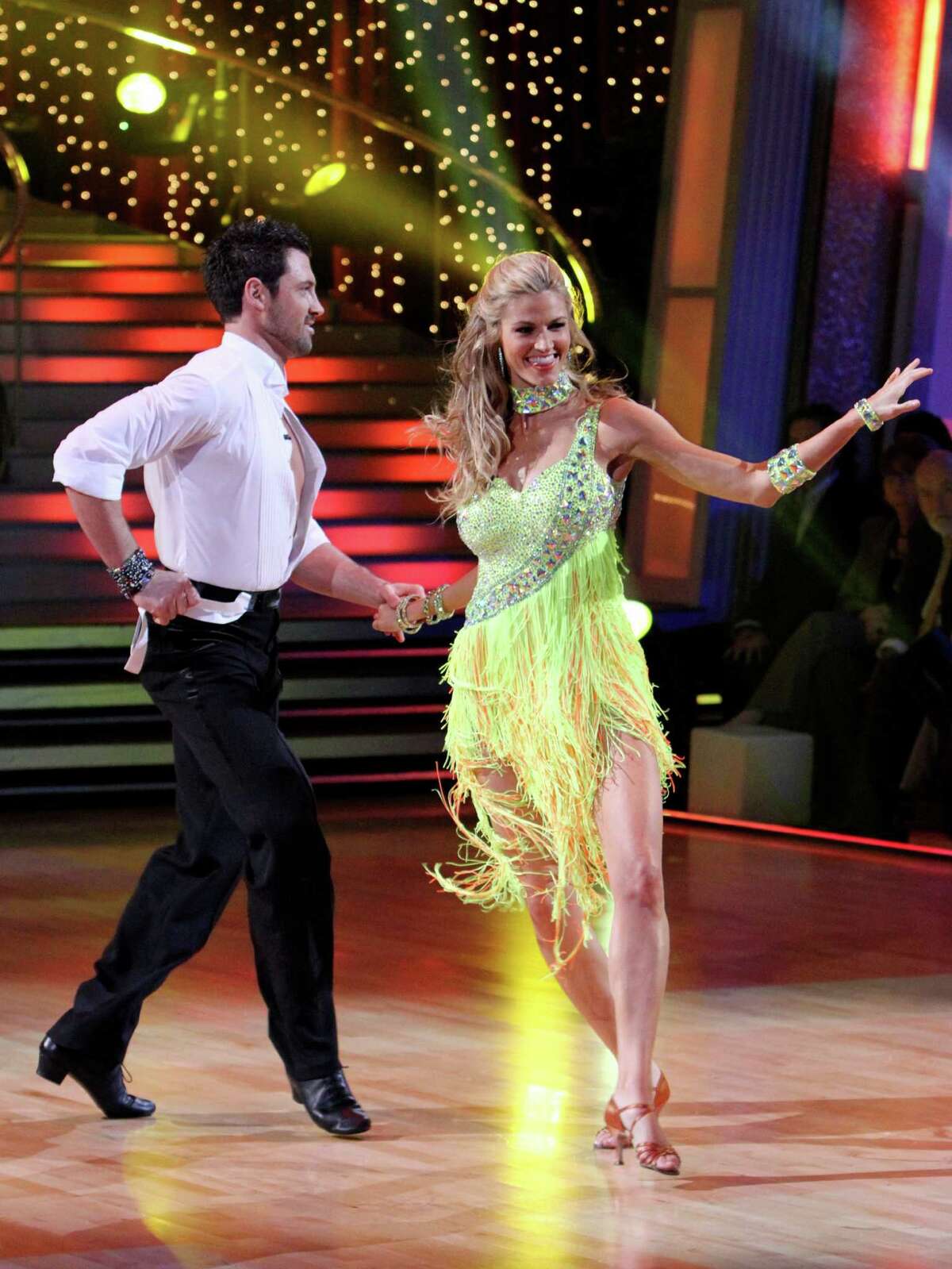 In this publicity image released by ABC, ESPN sportscaster Erin Andrews, right, and her partner Maksim Chmerkovskiy perform on the celebrity dance competition series, "Dancing With the Stars," Monday, March 22, 2010 in Los Angeles. (AP Photo/ABC, Adam Larkey)