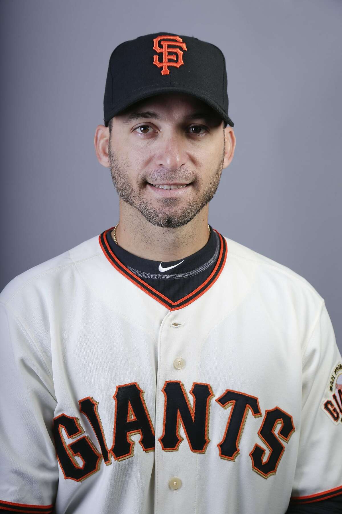 This is a 2014 photo of Marco Scutaro of the San Francisco Giants baseball team. This image reflects the Giants active roster as of Sunday, Feb. 23, 2014, when this image was taken. (AP Photo/ Gregory Bull)