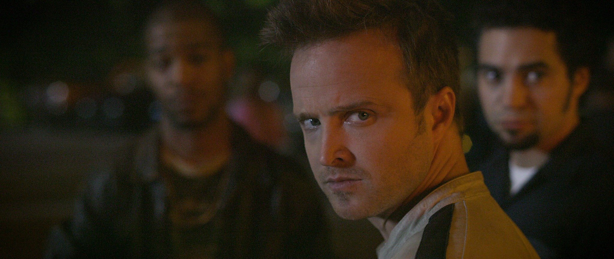 Tobey Marshall (Aaron Paul, center) with Benny (Scott Mescudi, left) and  Joe Peck (Ramon Rodriguez) are featured in this scene in DreamWorks  Pictures' Need for Speed, an exciting return to the great