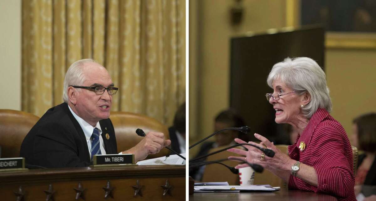 A two-photo combination shows Secretary of Health and Human Services Kathleen Sebelius fielding questions about the Affordable Care Act from Rep. Mike Kelly, R-Pa., during a House Ways and Means Committee hearing in Washington. Sebelius declined to reaffirm the administration's goal of 7 million sign-ups by March 31.