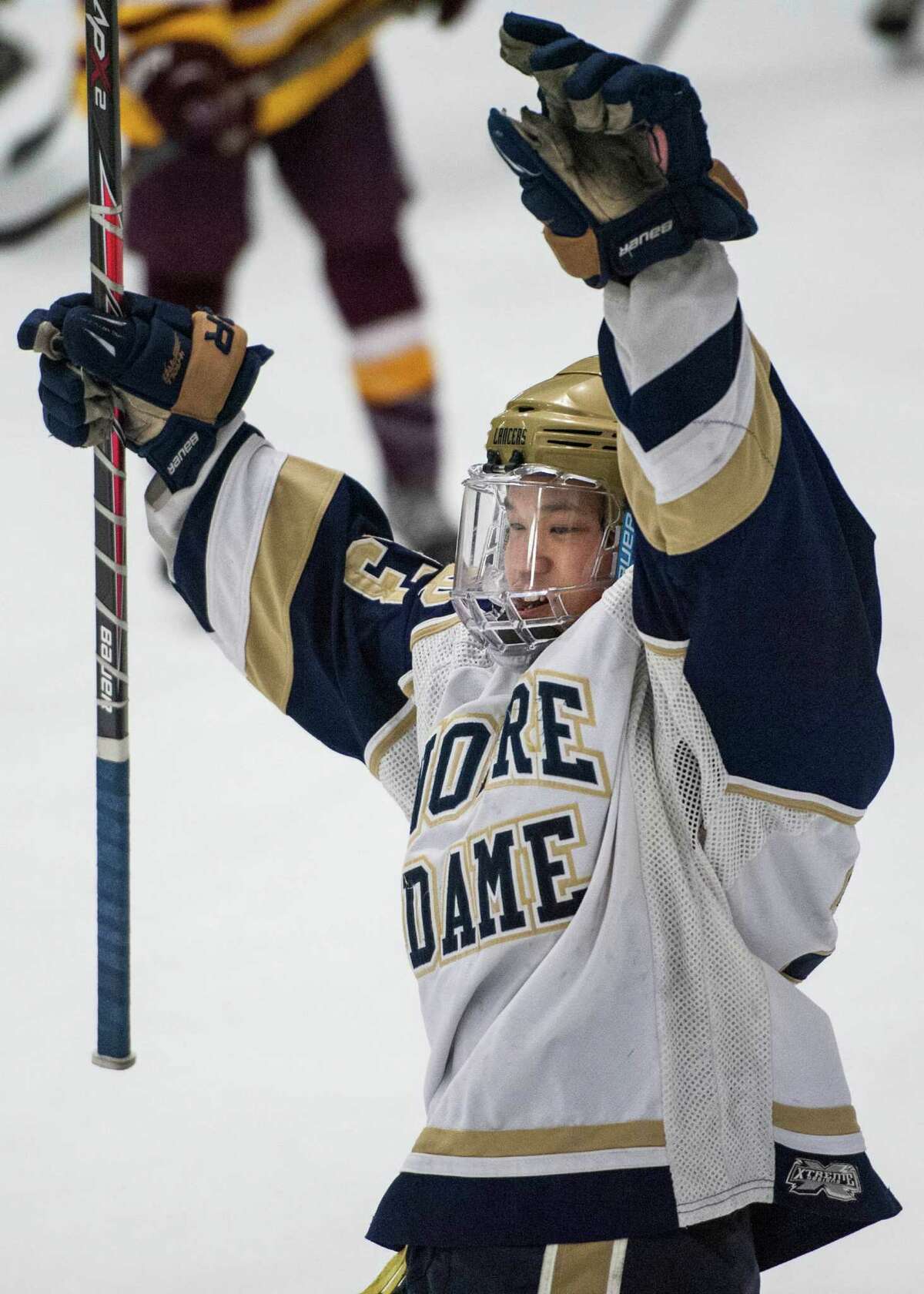 Notre Dame Fairfield high school's Jonny Suporn celebrates his team scoring a goal in the first period of a first round game of the CIAC division I boys ice hockey tournament against St. Joseph high school played at Milford Ice Pavilion, Milford, CT on Wednesday, March, 12th, 2014.