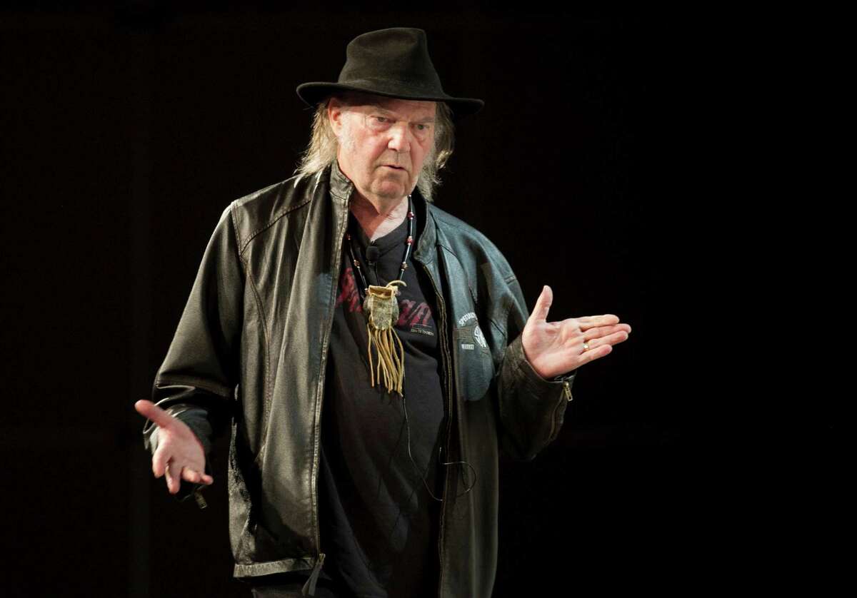 This Tuesday, March 11, 2014 photo shows Neil Young speaking during SXSW 2014 Music Festival in Austin, Texas. (AP Photo/Austin American-Statesman, Jay Janner)