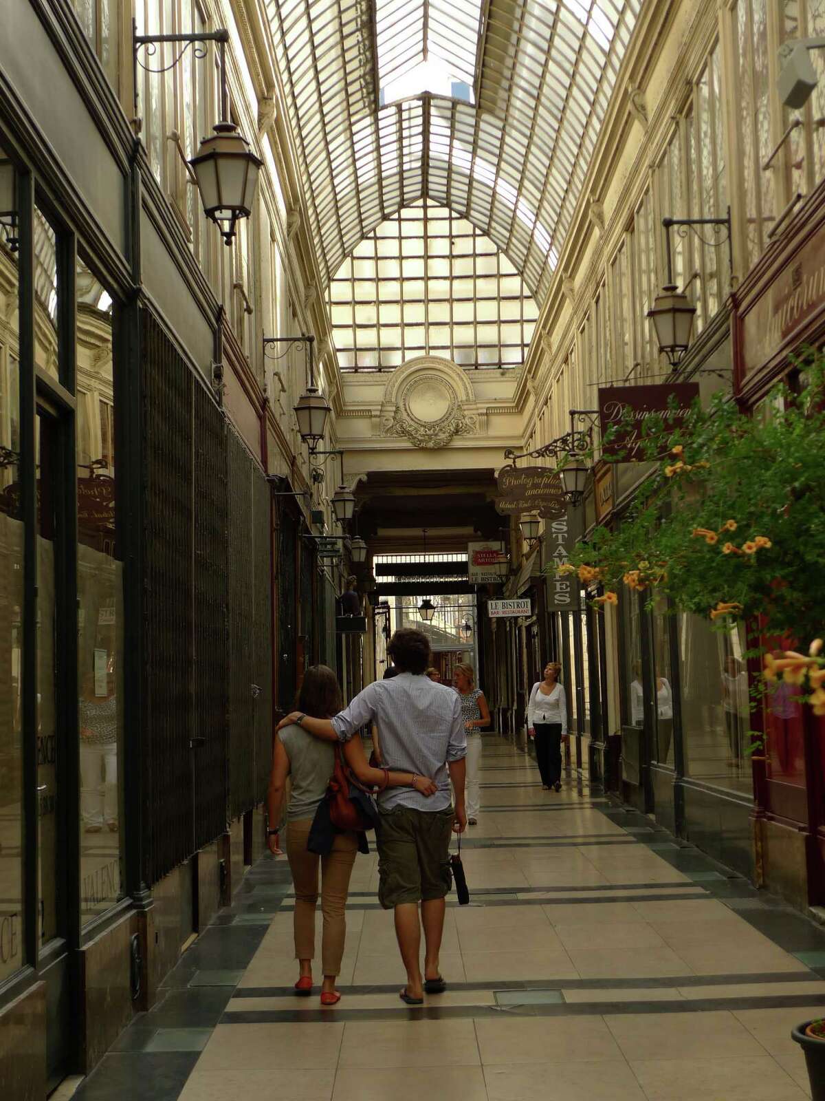 Locals stroll through Passage du Grand Cerf, one of the remaining covered passages in Paris.